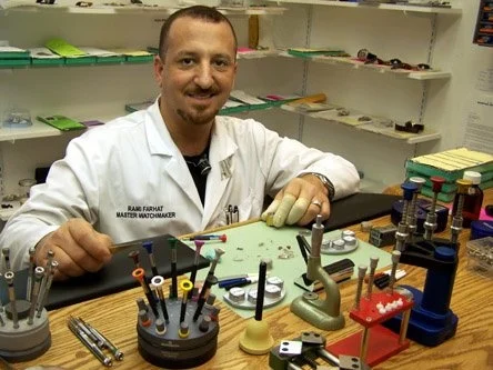 man repairing watches